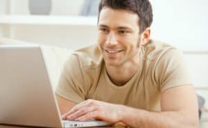 Man using laptop at home