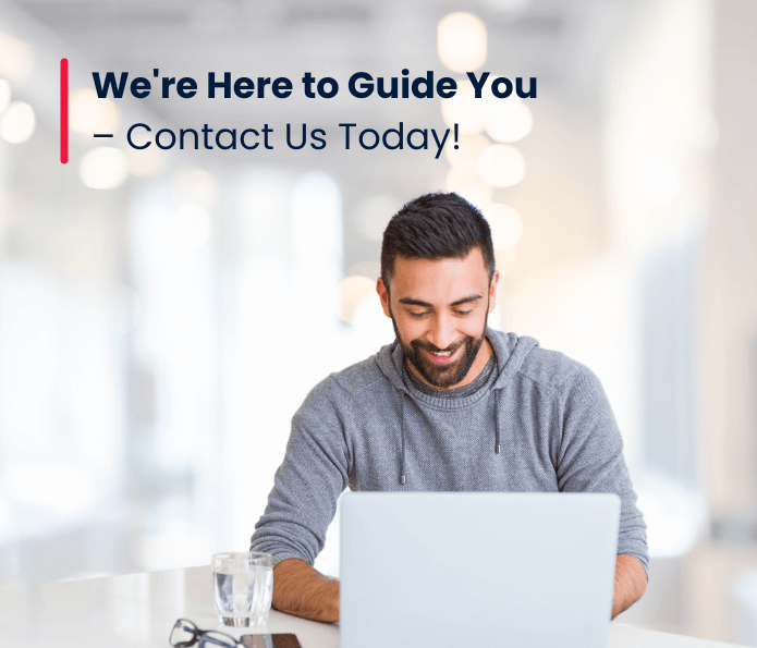 A man with a beard smiles whilst using a laptop at a desk with a glass of water. Text above reads, We’re Here to Guide You – Contact Us Today! Showcasing SDI Global Best Practice Standard for Service Desk. The background is softly blurred.
