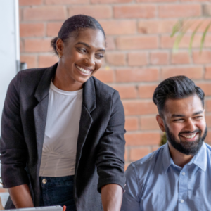People smiling in front of presentation