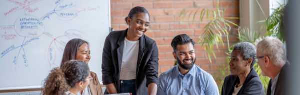 People smiling in front of presentation
