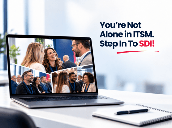 A laptop displays photos of people networking and attending a seminar. Text beside it reads, You’re Not Alone in ITSM. Step Into SDI—your IT service management hub! A notebook and pen are on the desk in the foreground.